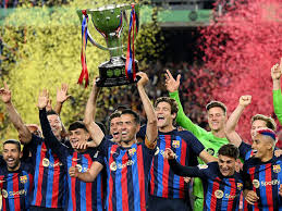 "FC Barcelona players celebrating in jerseys after La Liga win"